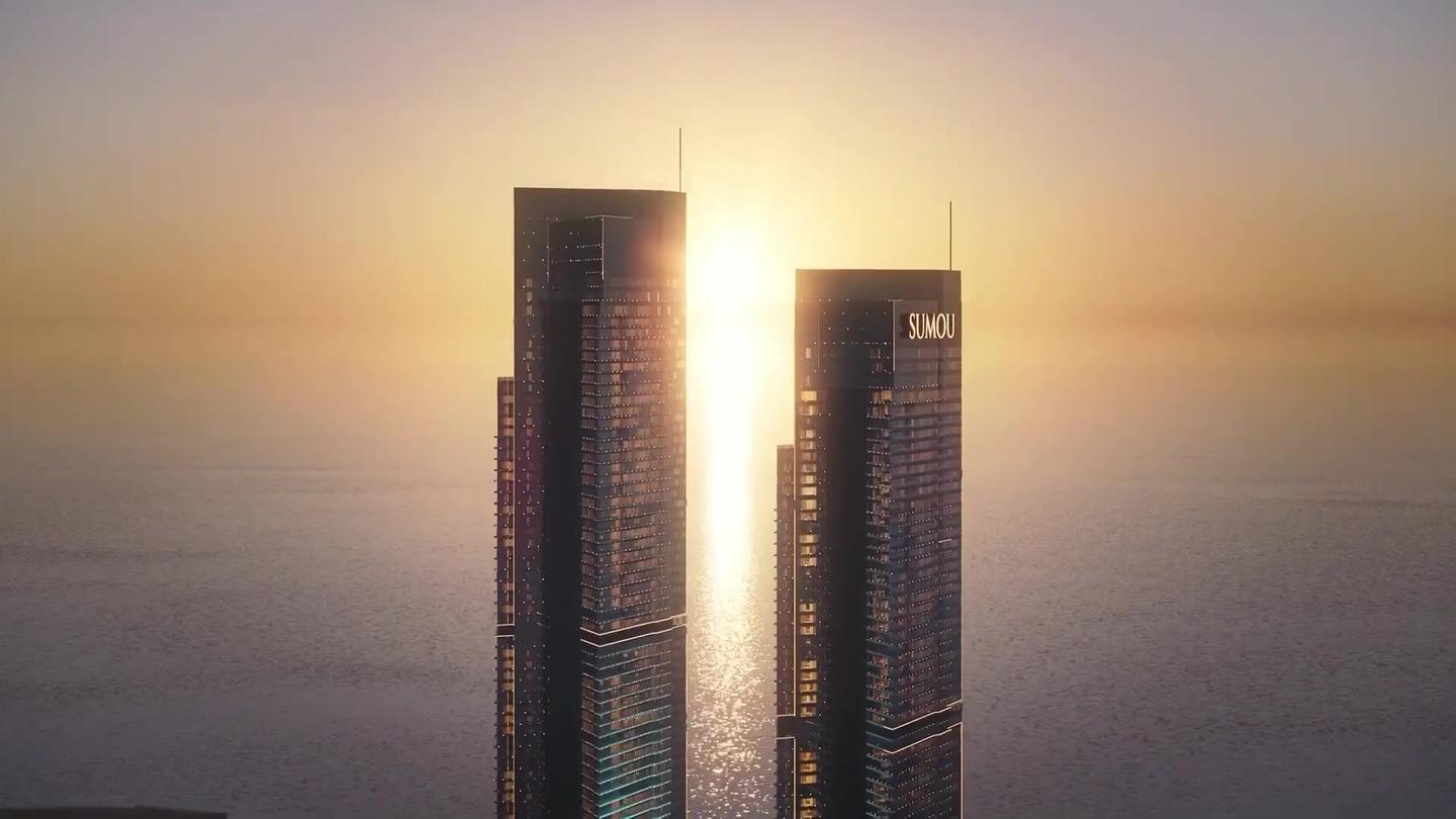 Sumou Towers in Jeddah at sunset, the sun between the two towers